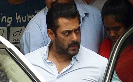 Indian Bollywood film actor Salman Khan leaves his home to appear at a Sessions Court in Mumbai on May 8, 2015. Salman Khan's five-year prison sentence for killing a homeless man with his SUV after a night out drinking 13 years ago was suspended on May 8, 2015, pending an appeal. (AFP)