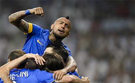 Juventus' Chilean midfielder Arturo Vidal (up) celebrates with teammates a goal by Juventus' Spanish forward Alvaro Morata during the UEFA Champions League semifinal second leg football match Real Madrid FC vs Juventus at the Santiago Bernabeu stadium in Madrid on May 13, 2015.(AFP)