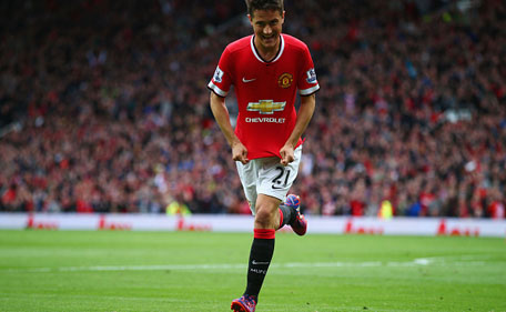 Ander Herrera of Manchester United celebrates as he scores their first goal during the Barclays Premier League match between Manchester United and Arsenal at Old Trafford on May 17, 2015 in Manchester, England. (Getty Images)