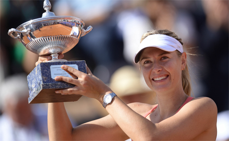 Maria Sharapova of Russia holds her trophy after winning the women's final match against Carla Suarez Navarro of Spain during at the WTA Tennis Open on May 17, 2015 at the Foro Italico in Rome.  (AFP)