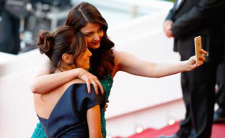 Actresses Eva Longoria and Aishwarya Rai pose for a selfie at the Premiere of 'Carol' during the 68th annual Cannes Film Festival on May 17, 2015 in Cannes, France. (Getty images)
