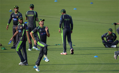Pakistan cricketers warm up during a practice session at the Gaddafi Cricket Stadium in Lahore on May 20, 2015. (AFP)