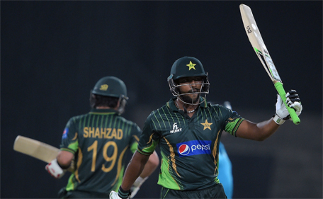 Pakistani batsman Mukhtar Ahmed celebrates after scoring 50 runs against Zimbabwe during the first International T20 cricket match at the Gaddafi Cricket Stadium in Lahore on May 22, 2015. (AFP)