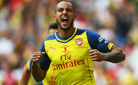 Theo Walcott of Arsenal celebrates as he scores their first goal during the FA Cup Final between Aston Villa and Arsenal at Wembley Stadium on May 30, 2015 in London, England. (Getty)