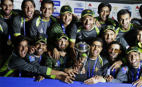 Pakistan's cricket team pose for a photograph with the trophy after winning the ODI series against Zimbabwe by 2-0 during a presentation ceremony at Gaddafi Stadium in Lahore, Pakistan, Sunday, May 31, 2015. (AP)