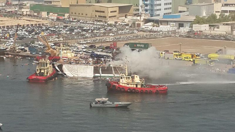 A cargo boat loaded with foodstuffs, fuel and other products caught fire near Port Khalid in Sharjah on Tuesday morning. (Image courtesy Ghafoor Bekal)