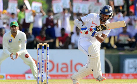 Sri Lanka batsman Dimuth Karunaratne plays a shot on day of the 1st Test between Sri Lanka and Pakistan on the 4th day in Galle, June 20, 2015. (AFP)