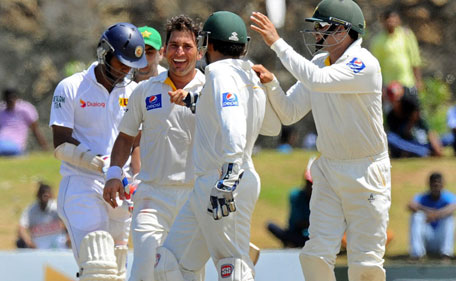 Pakistan spinner Yasir Shah celebrates dismissing Sri Lanka batsman Dimuth Karunaratne' on day five of the 1st Test, in Galle on June 21, 2015. (AFP)