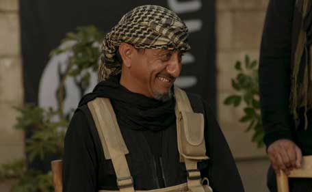 Saudi actor Nasser al-Qasabi smiles as he plays the role of an Islamic State fighter in the new Saudi TV show 'Selfie,' a sketch comedy show which debuted last week on Saudi-owned pan-Arab satellite channel MBC, in this undated handout photo provided by MBC. (Reuters)