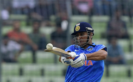 Indian cricket captain Mahendra Singh Dhoni plays a shot during the third ODI cricket match between Bangladesh and India at the Sher-e-Bangla National Cricket Stadium in Dhaka on June 24, 2015. (AFP)