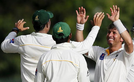 Pakistan's Yasir Shah (right) celebrates with his teammates after taking the wicket of Sri Lanka's Tharindu Kaushal (not pictured) during the second day of their second Test cricket match against Pakistan in Colombo June 26, 2015. (Reuters)