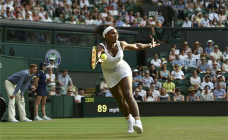 Serena Williams of the U.S.A. stretches for a shot during her match against Timea Babos of Hungary at the Wimbledon Tennis Championships in London, July 1, 2015. (Reuters)