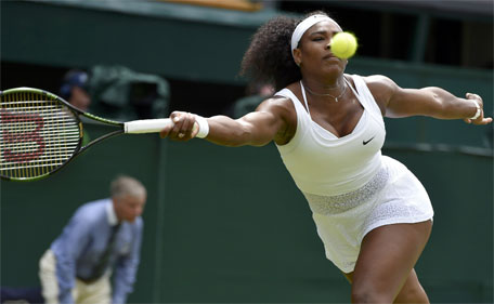 Serena Williams hits a shot during her match against Venus Williams at the Wimbledon Tennis Championships in London, July 6, 2015. (Reuters)