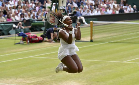 Serena Williams of the U.S.A. celebrates after winning her match against Victoria Azarenka of Belarus at the Wimbledon Tennis Championships in London, July 7, 2015. (Reuters)