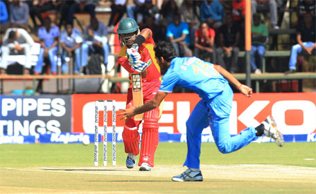 Zimbabwean batsman Chamunorwa Chibhabha plays a shot to Indian bowler Bhuvneshwar Kumar on the third day of the One Day International  cricket match against India in  Harare, Zimbabwe, Tuesday, July 14, 2015.   (AP)