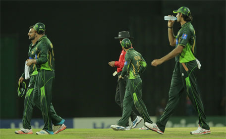 Pakistan players leave the field following  spectators clash during the third one day international cricket match between Sri Lanka and pakistan in Colombo, Sri Lanka, Sunday, July 19, 2015. The play was suspended for some time following crowd trouble.(AP)