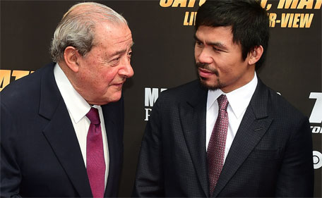 This file photo taken on March 11, 2015 shows Philippine boxer Manny Pacquiao listening while on the carpet with boxing promoter Bob Arum (left) on arrival in Los Angeles, California for the Floyd Mayweather vs Manny Pacquiao press conference ahead of their fight in Las Vegas. (AFP)