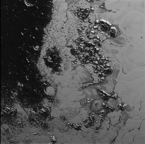 A newly discovered mountain range lies near the southwestern margin of Pluto&rsquo;s Tombaugh Regio (Tombaugh Region). This image was acquired by New Horizons&rsquo; Long Range Reconnaissance Imager (Lorri) on July 14, 2015 from a distance of 48,000 miles (77,000km) and received on Earth on July 20. Features as small as a half-mile (1km) across are visible.(Nasa)