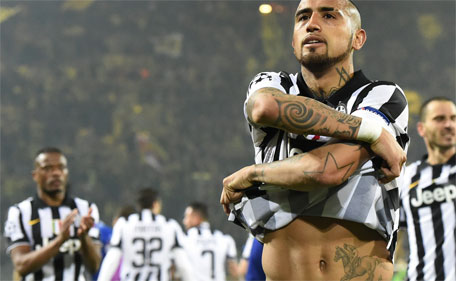 A photo taken on March 18, 2015 in Dortmund shows Juventus' midfielder Arturo Vidal (R) leaving the pitch after the Round of 16, second-leg UEFA Champions League football match Borussia Dortmund vs Juventus. (AFP)