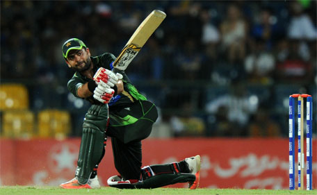 Pakistan cricketer Ahmed Shehzad plays a shot during the fourth One Day International (ODI) match between Sri Lanka and Pakistan at the R Premadasa International Cricket Stadium in Colombo on July 22, 2015. (AFP)