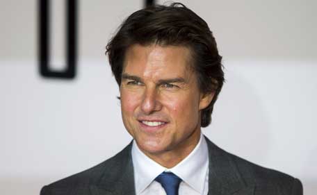 US actor Tom Cruise poses for photographers at a British screening of the film 'Mission Impossible: Rogue Nation' in London, Britain July 25, 2015. (Reuters)