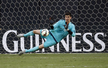 Chelsea's Thibaut Courtois stops a penalty kick after the second half of an International Champions Cup soccer match in Charlotte, N.C., Saturday, July 25, 2015.
