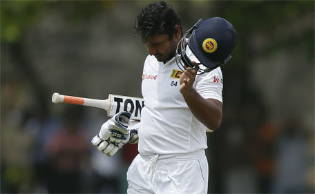 Sri Lanka's Kumar Sangakkara reacts as he walks off the field after his dismissal by India's Ravichandran Ashwin (not pictured) during the first day of their first Test cricket match in Galle August 12, 2015. (Reuters)