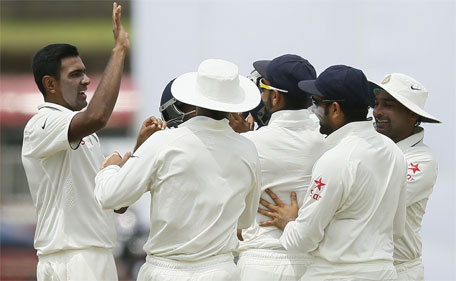 India's Ravichandran Ashwin (left) celebrates with his teammates after the taking the wicket of Sri Lanka's Kumar Sangakkara (not pictured) during the first day of their first Test cricket match in Galle August 12, 2015. (Reuters)