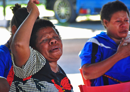 Grieving relatives of the missing Trigana Air ATR 42-300  aircraft and feared to have crashed cry as they wait for information at the crisis centre in Jayapura on August 17, 2015. Rescuers headed August 17 to the site in remote eastern Indonesia where debris has been spotted after a plane crashed with 54 people aboard at the weekend, the latest accident to hit the country's aviation sector.  (AFP)