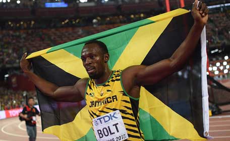 Jamaica's Usain Bolt celebrates winning the final of the men's 100 metres athletics event at the 2015 IAAF World Championships at the "Bird's Nest" National Stadium in Beijing on August 23, 2015. (AFP)