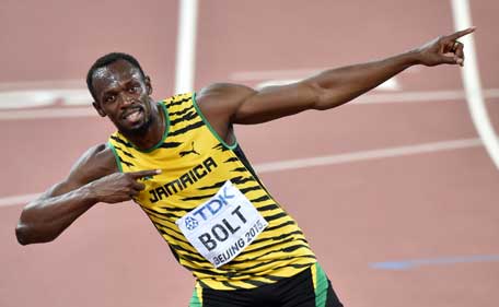 Jamaica's Usain Bolt celebrates winning the final of the men's 100 metres athletics event at the 2015 IAAF World Championships at the "Bird's Nest" National Stadium in Beijing on August 23, 2015. (AFP)