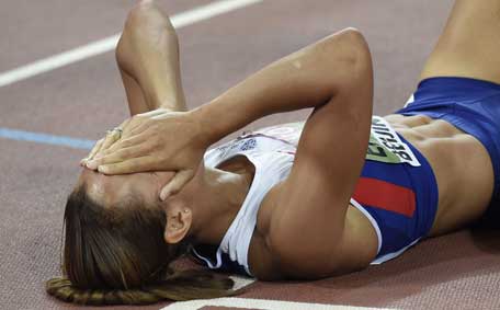 Britain's Jessica Ennis-Hill celebrates after winning the 800 metres of the women's heptathlon athletics event at the 2015 IAAF World Championships at the 'Bird's Nest' National Stadium in Beijing on August 23, 2015.  (AFP)