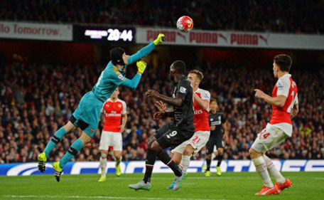 Arsenal's Petr Cech in action with Liverpool's Christian Benteke during the Barclays Premier League at Emirates Stadium - 24/8/15. (Action Images via Reuters)