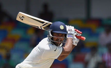 Indian cricketer Cheteshwar Pujara plays a shot during the second day of the third and final Test cricket match between Sri Lanka and India at the Sinhalese Sports Club (SSC) in Colombo on August 29, 2015.  (AFP)