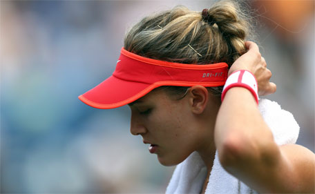 Eugenie Bouchard reacts against Dominika Cibulkova of Slovakia during their Women's Singles Third Round match on Day Five of the 2015 US Open at the USTA Billie Jean King National Tennis Center on September 4, 2015 in the Flushing neighborhood of the Queens borough of New York City. (AFP)