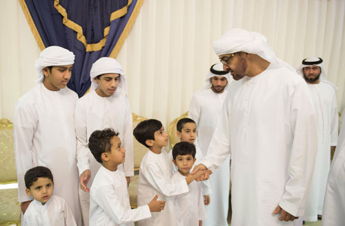 Sheikh Mohamed bin Zayed Al Nahyan meets children during condolences to the family of martyr Saeed Al Ali who passed away while serving the UAE Armed Forces in Yemen (Wam )