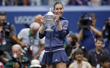 Flavia Pennetta of Italy holds the U.S. Open Trophy after defeating compatriot Roberta Vinci in their women's singles final match at the U.S. Open Championships tennis tournament in New York, September 12, 2015.
(Reuters)
