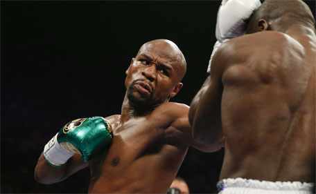 Floyd Mayweather Jr. hits Andre Berto during their welterweight title boxing bout Saturday, Sept. 12, 2015, in Las Vegas. (AP)