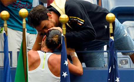 Italian tennis player Fabio Fognini greets Flavia Pennetta of Italy after she won her Women's Singles Final against Roberta Vinci of Italy on Day Thirteen of the 2015 US Open at the USTA Billie Jean King National Tennis Center on September 12, 2015 in the Flushing neighborhood of the Queens borough of New York City.  (AFP)