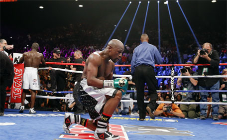 Floyd Mayweather Jr. kneels at the end of his welterweight title fight against Andre Berto Saturday, Sept. 12, 2015, in Las Vegas. (AP)