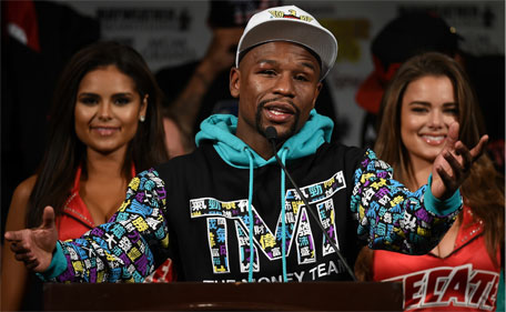 Floyd Mayweather Jr. speaks during a post-fight news conference at MGM Grand Hotel & Casino after he retained his WBC/WBA welterweight titles in a unanimous decision-victory over Andre Berto on September 12, 2015 in Las Vegas, Nevada. (AFP)