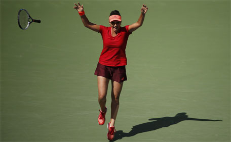Sania Mirza of India celebrates match point as she and Martina Hingis of Switzerland (not pictured) defeat Casey Dellacqua of Australia and Yaroslava Shvedova of Kazakhstan to win the women's doubles final match at the U.S. Open Championships tennis tournament in New York, September 13, 2015. (Reuters)