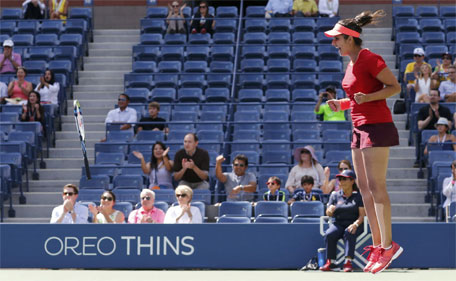 Sania Mirza of India celebrates match point as she and Martina Hingis of Switzerland (not pictured) defeat Casey Dellacqua of Australia and Yaroslava Shvedova of Kazakhstan to win the women's doubles final match at the U.S. Open Championships tennis tournament in New York, September 13, 2015. (Reuters)