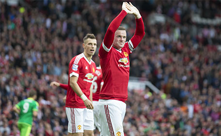 Manchester United's Wayne Rooney celebrates after scoring during the English Premier League soccer match between Manchester United and Sunderland at Old Trafford Stadium, Manchester, England, Saturday, Sept. 26, 2015. (AP)