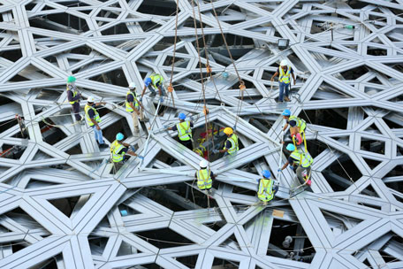 Final piece of the outer cladding of the dome structure of the future Louvre museum still under contruction on Saadiyat island, near Abu Dhabi. (AFP)