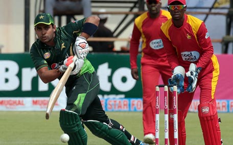 Pakistan's batsman Umar Akmal (L) plays a shot during the second of two T20 cricket matches between Zimbabwe and Pakistan at Harare Sports Club on September 29, 2015. AFP