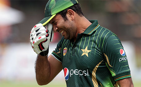 Pakistan's batsman Sohaib Maqsood reacts as he leaves the pitch after losing his wicket during the second of two T20 cricket matches between Zimbabwe and Pakistan at Harare Sports Club on September 29, 2015. (AFP)