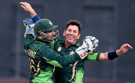 Pakistani bowler Yasir Shah (right)celebrates a wicket with wicketkeeper Sarfraz Ahmed during the first in a series of three One Day International (ODI) cricket matches between Pakistan and hosts Zimbabwe at the Harare Sports Club, in Harare on October 1, 2015. (Getty)
