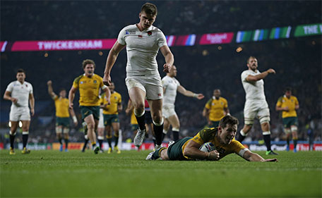 Australia's fly half Bernard Foley (right) scores his team's second try  during a Pool A match of the 2015 Rugby World Cup between England and Australia at Twickenham stadium, south west London, on October 3, 2015. (AFP)