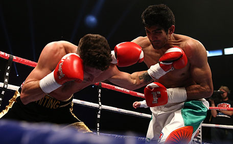 Vijender Singh of India and Sonny Whiting of Great Britain exchange blows during their International Middleweight contest at Manchester Arena on October 10, 2015 in Manchester, England. (Getty Images)